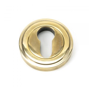 From The Anvil - Aged Brass Round Euro Escutcheon (Art Deco) 45708