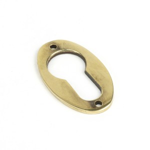 From The Anvil - Aged Brass Oval Euro Escutcheon 83819
