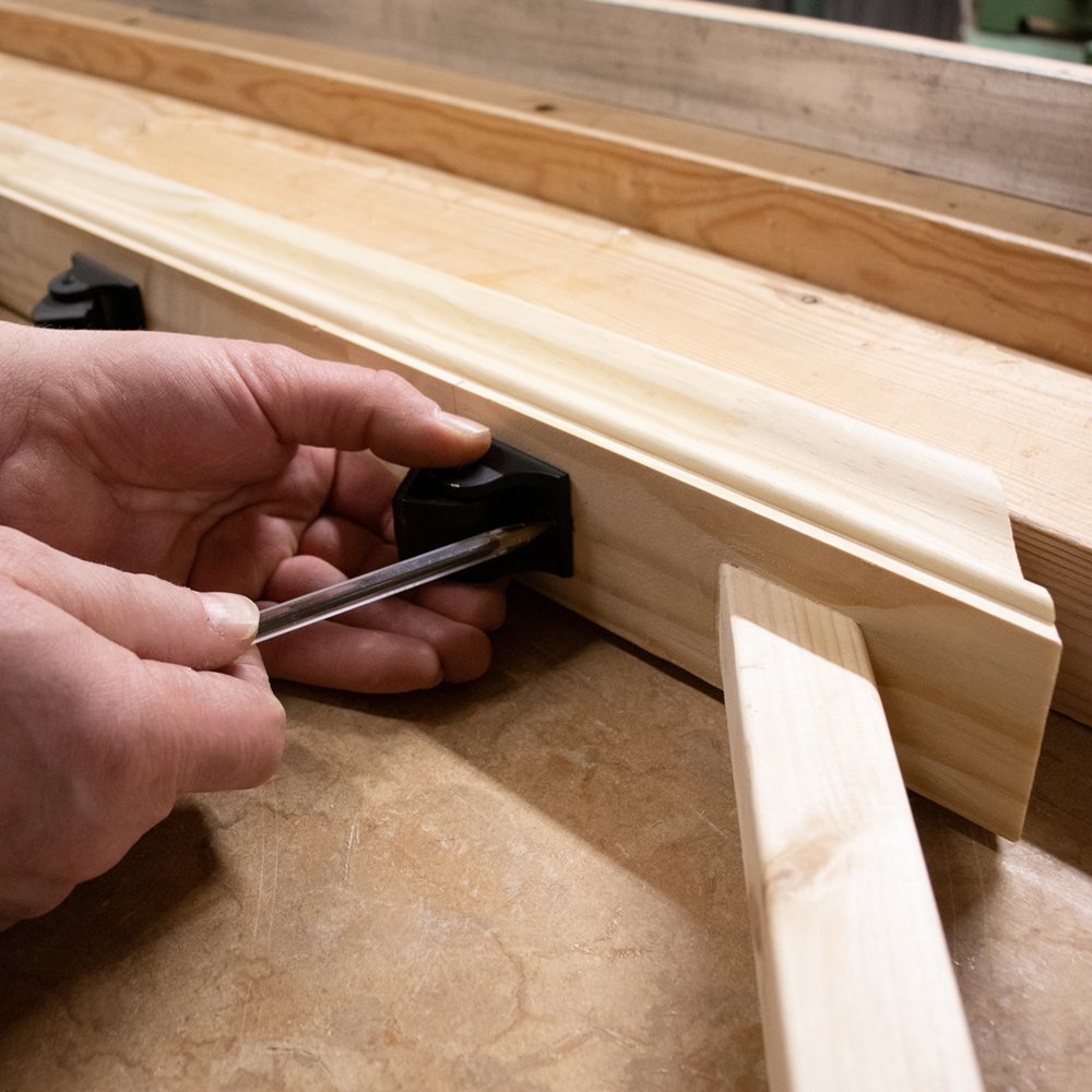 Marking bracket position for fitting Pear Stairs metal spindles into balustrades.