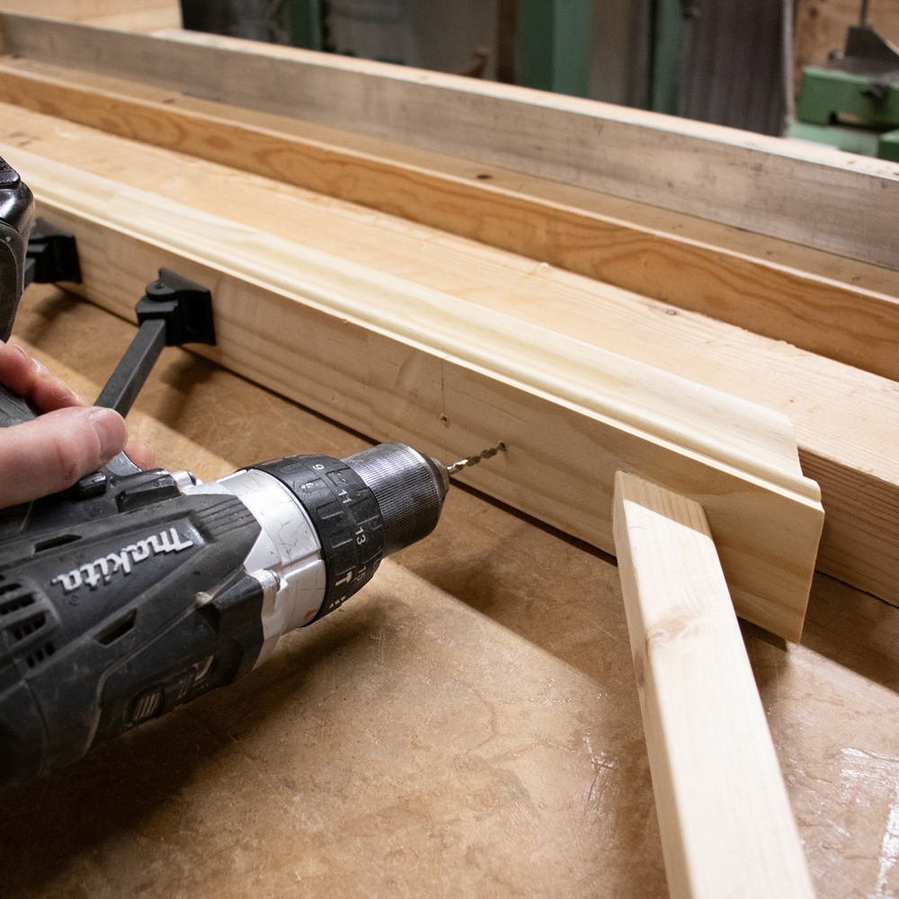 Drill pilot holes for brackets to install metal spindles into balustrade.