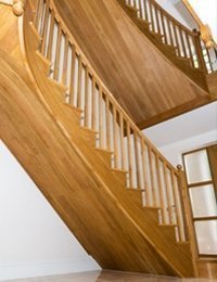 Pair of curved stairs in American white oak