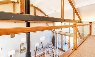 Glass landing balustrade by Pear Stairs