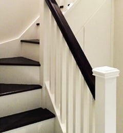 White stairs with dark sapele treads and handrail