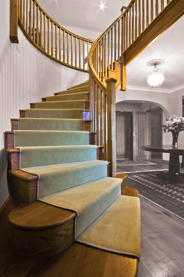 Curved oak staircase by Pear Stairs