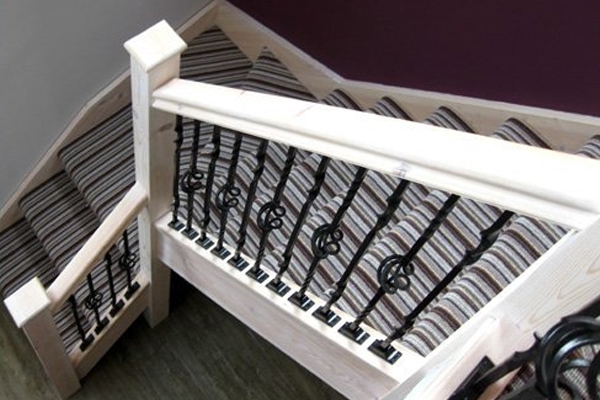 Staircase with a striped runner