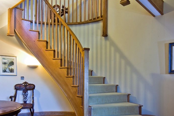 Curved handrail following the arch of the stairs